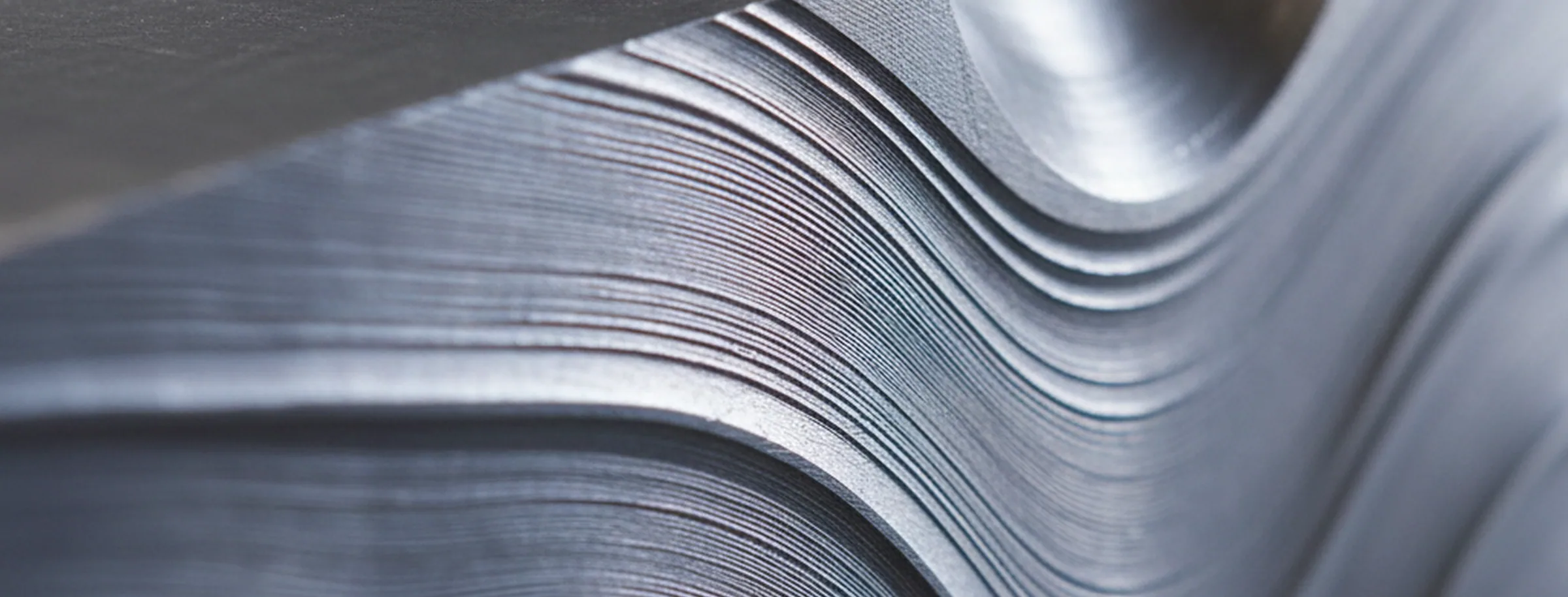 Etched macro section of forged H11 tool steel with the grain flow running through the block