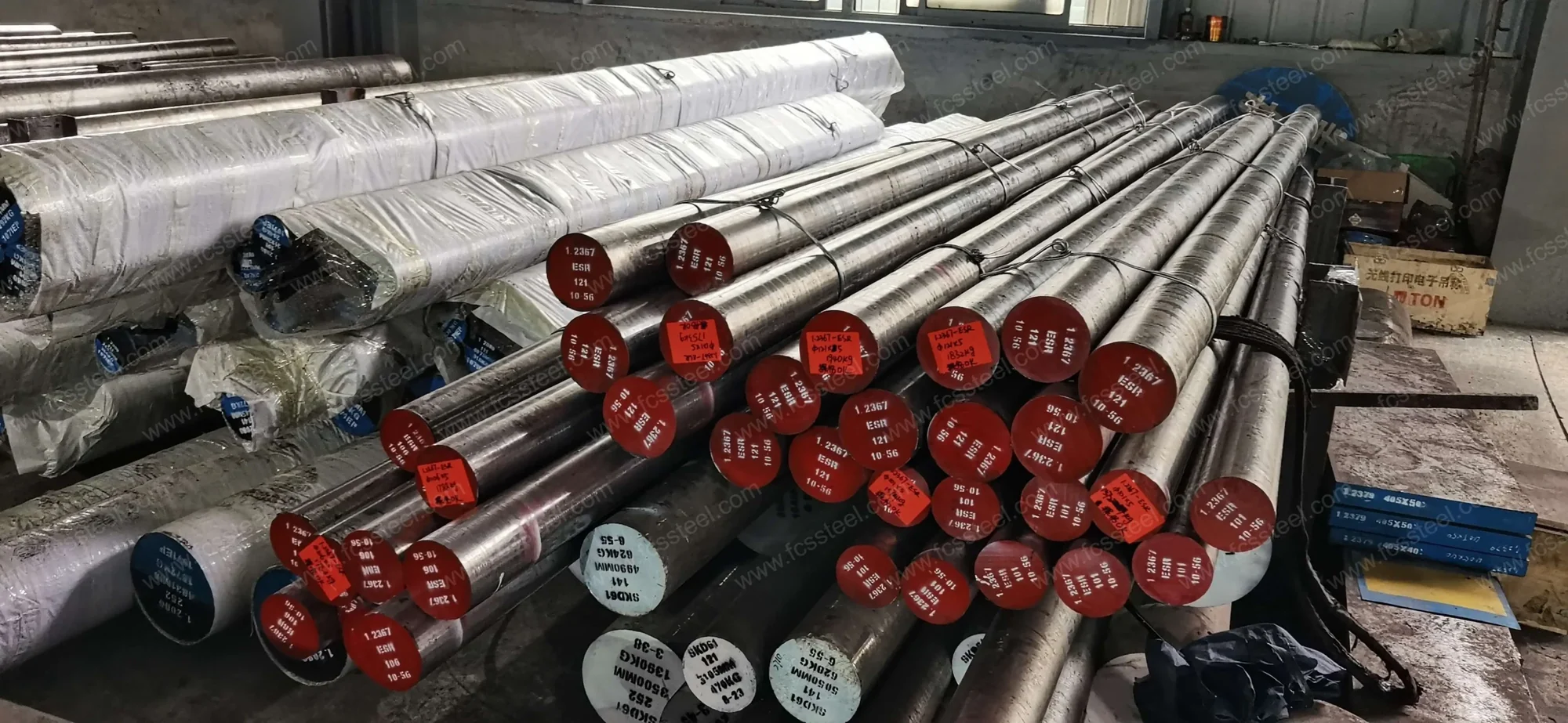 Forged hot work bar staged after annealing with painted heat identification