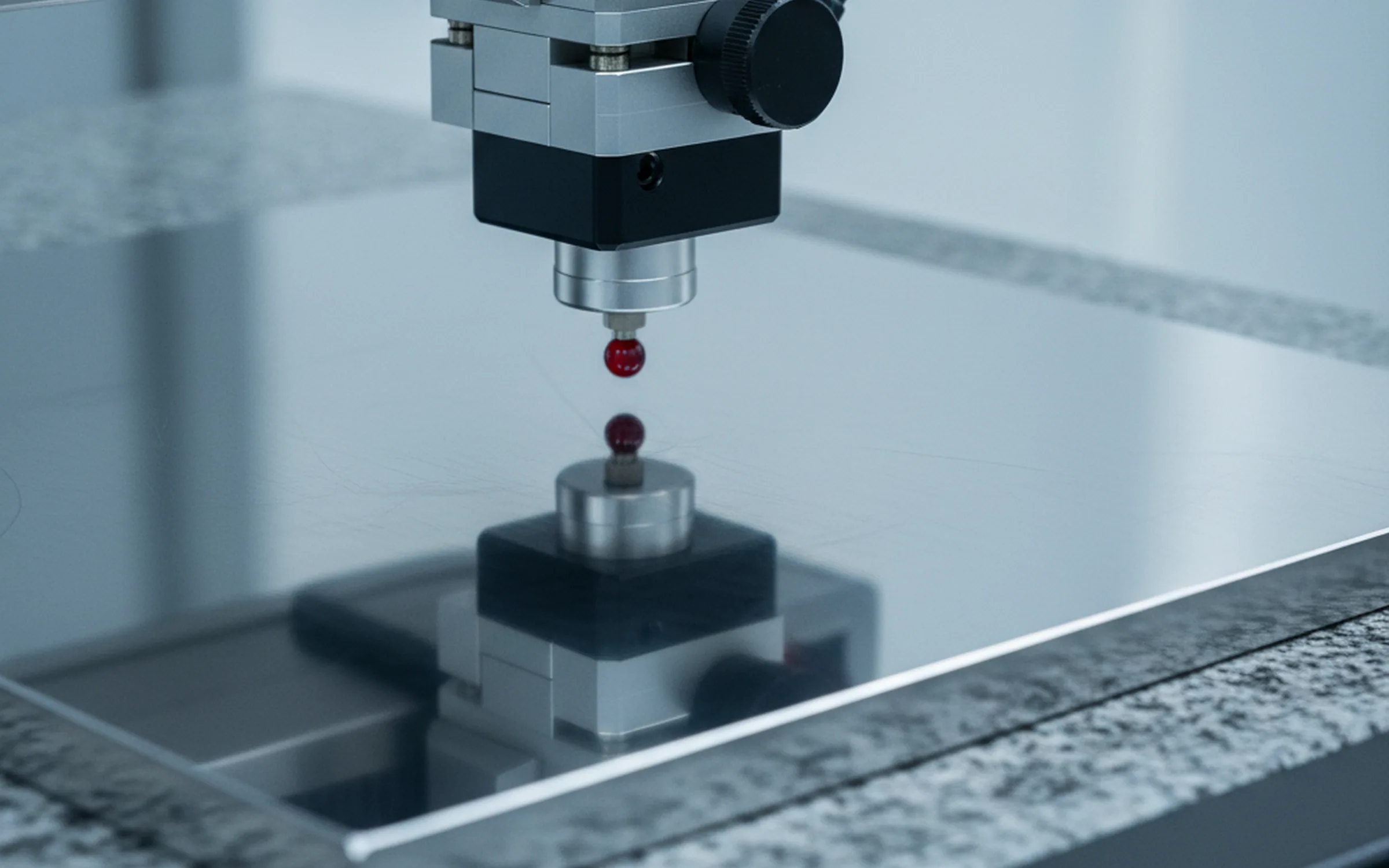 Coordinate measuring machine probing a ground tool steel plate for dimensions and geometry